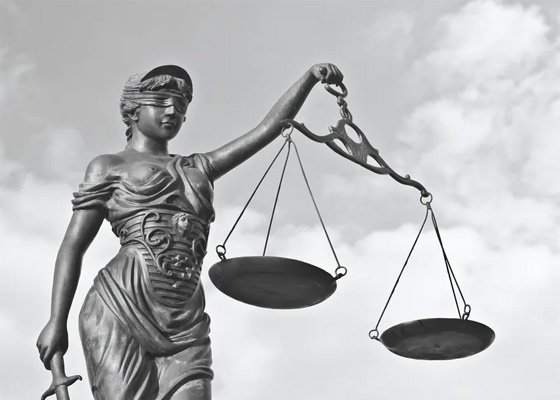 Lady of justice holding scales, symbolizing fair and evidence-based decision-making in employment law and WRC unfair dismissal cases